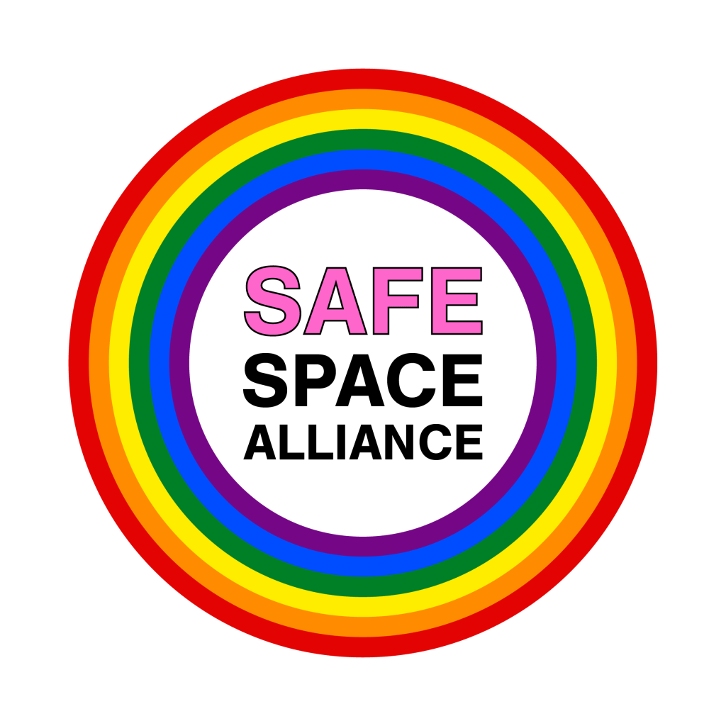Logo of Safe Space Alliance featuring the text 'SAFE SPACE ALLIANCE' in pink within a circular rainbow design.